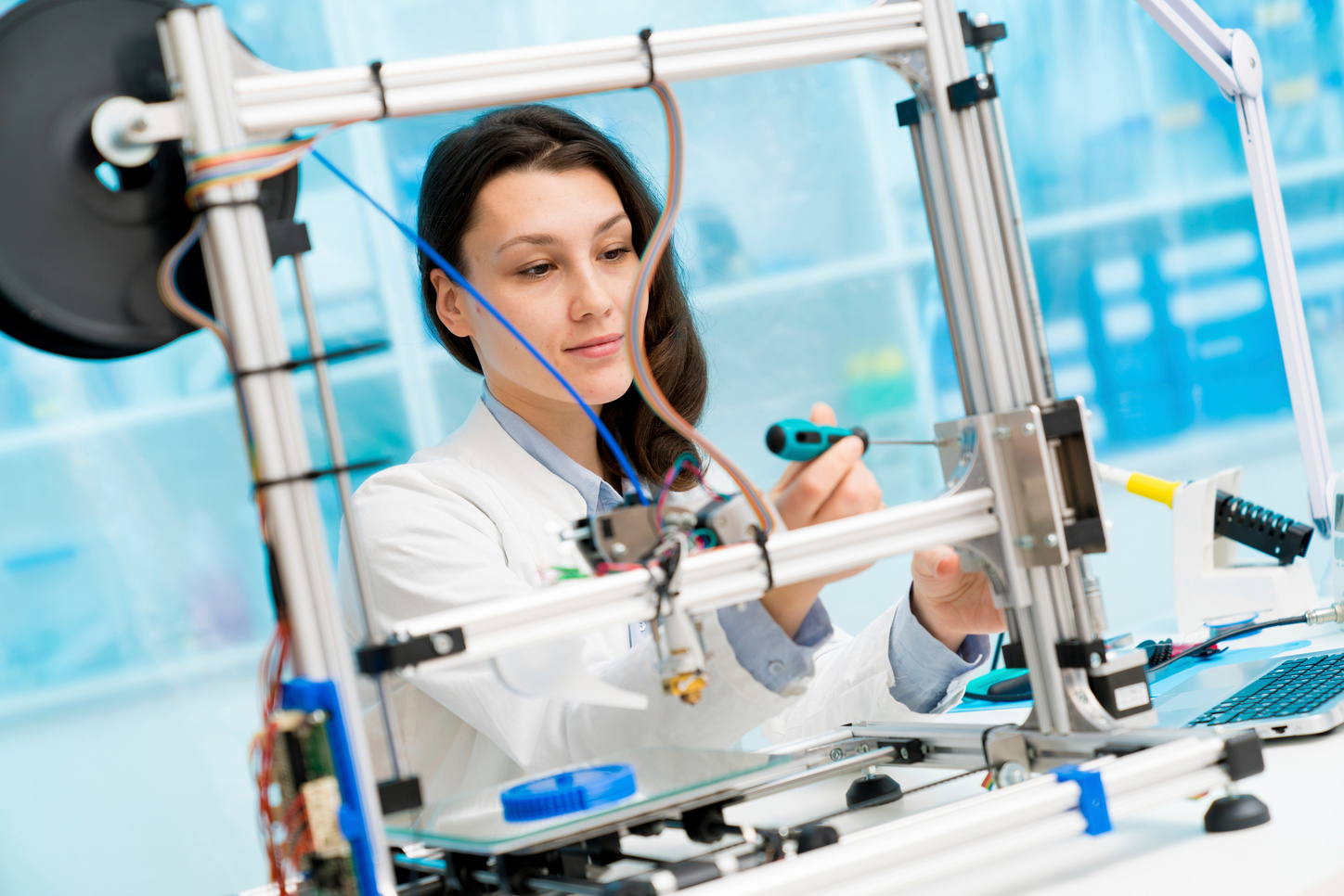 Technician working on 3D printer