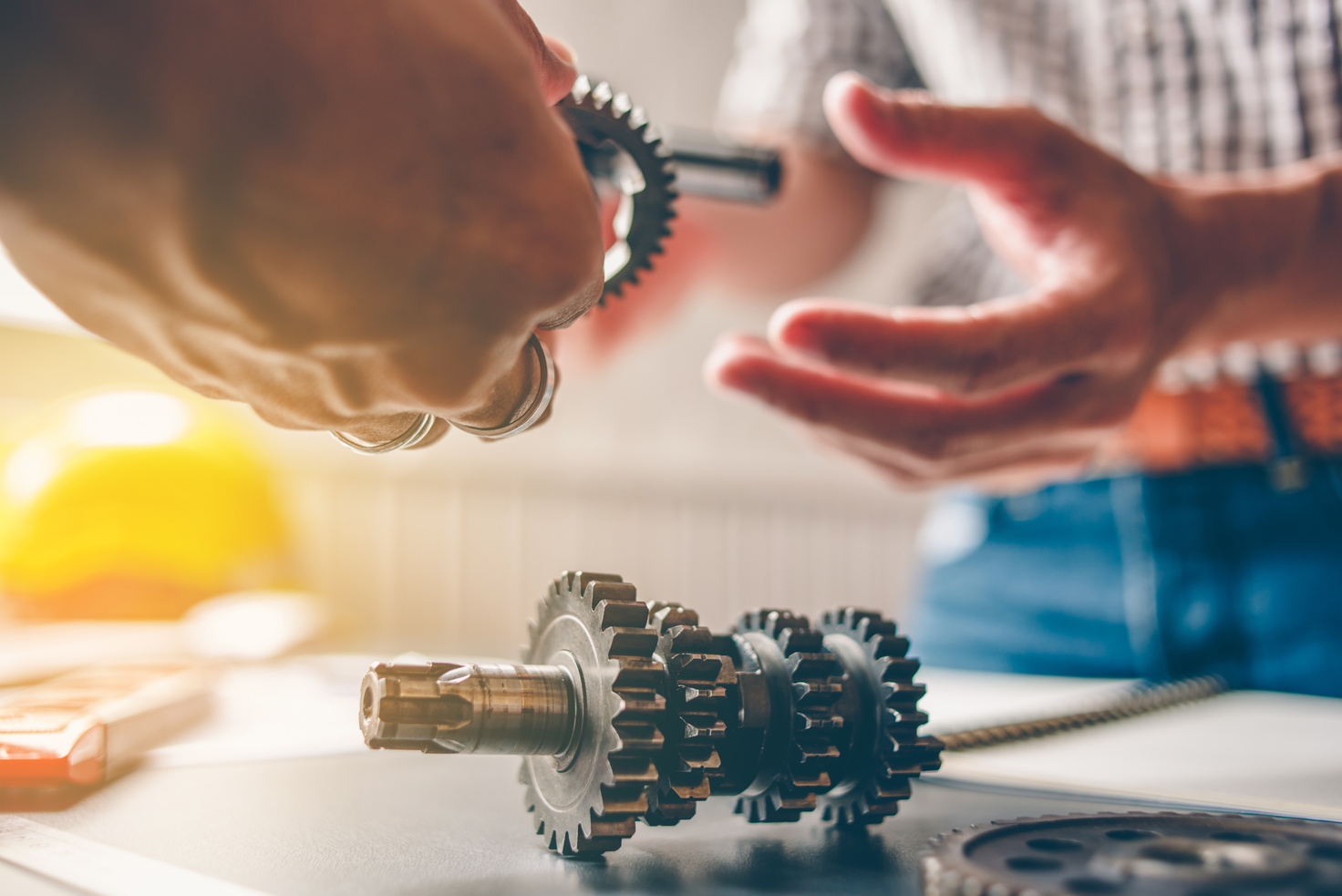 The mechanical engineering team is consulting the gear design.